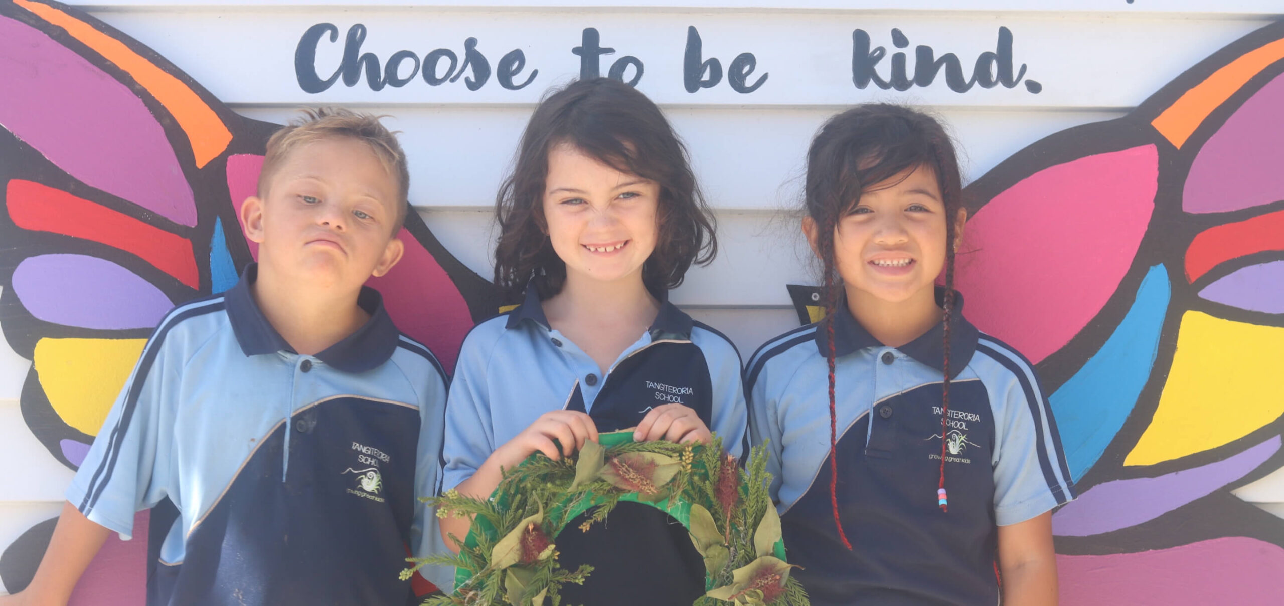 An image of three school children from Tangiteroria School
